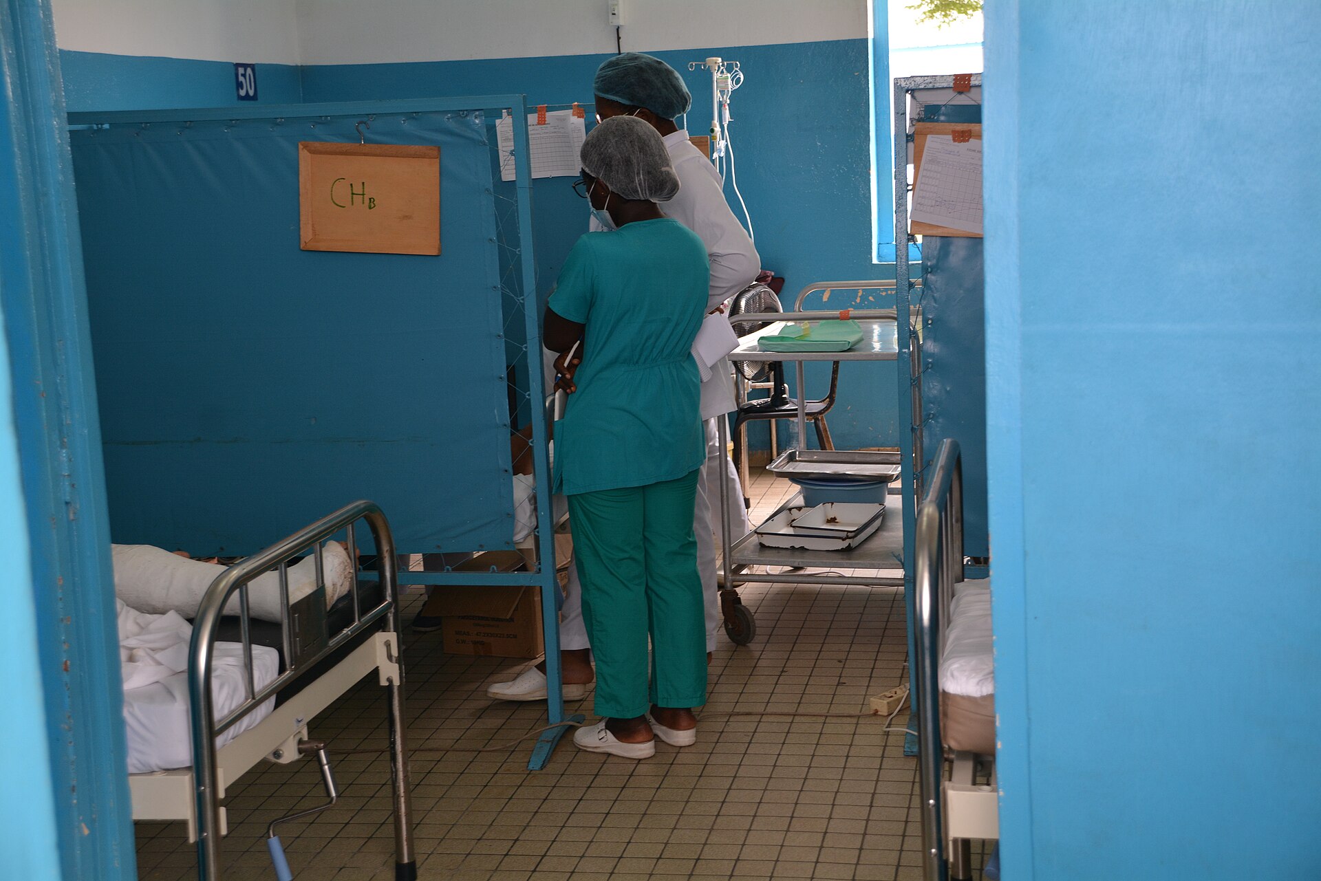 A doctor and nurse stand in a hospital room in Douala, Cameroon.