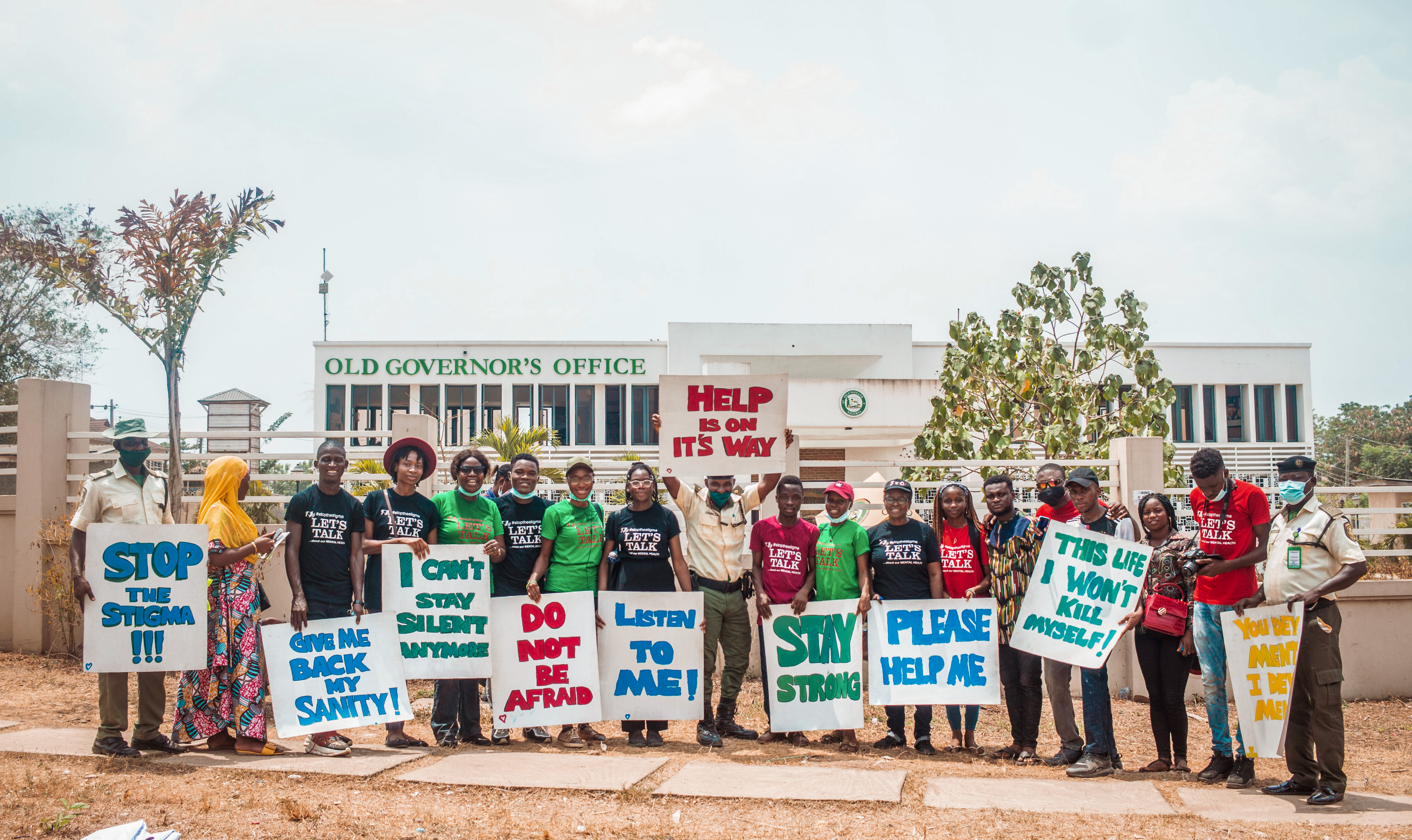 Placards promote understanding of mental illness at an anti-stigma event in Nigeria.